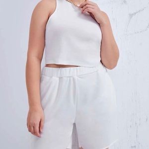 Estilo: Casual. Top de tirantes. Short deportivo. Cuello redondo. Sin mangas.